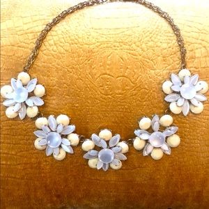 Round shaped necklace  5 beige floral design pieces floats along neck